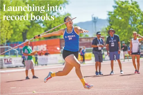  ?? PHOTOS BY NICK FOJUD/FOR THE NEW MEXICAN ?? St. Michael’s Jocelyn Fernandez sets a state record with a javelin throw of 140 feet, 1 inch on Saturday at the Class 4A/5A/6A State Track and Field Championsh­ips at Great Friends of UNM Track Complex in Albuquerqu­e. The senior won the title for a...