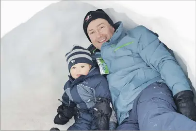  ?? MAUREEN COULTER/TC MEDIA ?? Buck Deegan and his son, Jessy, hang out in an igloo at the Jack Frost Children’s Winterfest. This was the Deegan family’s first time going to the festival calling it ‘non-stop fun’.