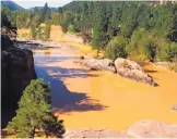  ?? FARMINGTON DAILY TIMES ?? Polluted water flows in the Animas River north of Durango, Colo., in August 2015 after the Gold King Mine spill near Silverton, Colo.