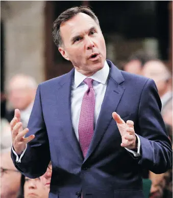  ?? DAVID KAWAI/THE CANADIAN PRESS ?? Under pressure from businesses, Finance Minister Bill Morneau is likely to extend immediate tax writeoffs to 75 per cent of capital investment­s, up from 50 per cent, according to a source.