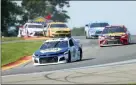  ?? JOHN MUNSON — THE ASSOCIATED PRESS ?? Chase Elliott leads the field thought the area known as “The Bus Stop” during a NASCAR Cup Series auto race at Watkins Glen Internatio­nal, Sunday in Watkins Glen, N.Y.