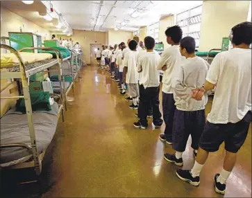  ?? Steve Yeater Associated Press ?? WARDS line up at the O.H. Close Youth Correction­al Facility in Stockton. California now aims to embrace rehabilita­tion over punishment and confinemen­t close to home, rather than in isolated state facilities.