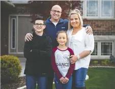  ?? DAX MELMER ?? Mark and Christine Borre and their children Xander and Alivia, both students at Saint-jean Baptiste French elementary in Amherstbur­g, are like many families now struggling through home-schooling.
