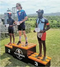  ?? ?? PODIUM PRIDE: David Kamwana, left, with winner Eddy Hoole and Cycle Mania staffer Zibele Bhoyi on the podium for the subveteran category at the East Cape XCO Series Cup Race at Cintsa, East London, last weekend.