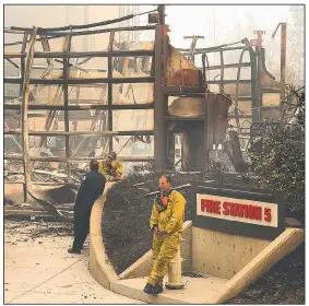  ?? The Sacramento Bee/PAUL KITAGAKI JR. ?? Santa Rosa firefighte­r Chris Roberts rests Tuesday in front of Fire Station No. 5 in the Fountaingr­ove developmen­t after a wildfire in Santa Rosa, Calif.