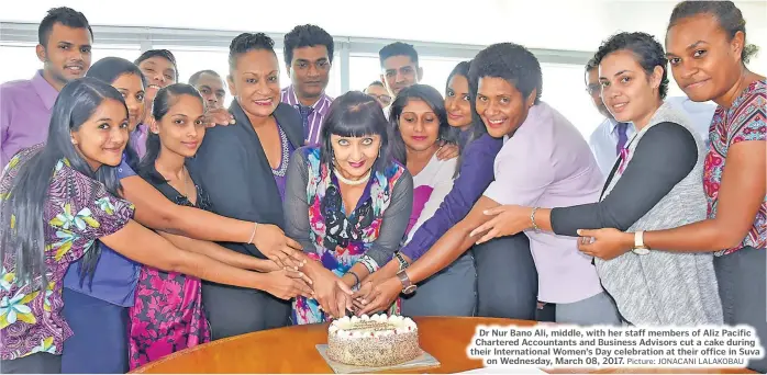  ?? Picture: JONACANI LALAKOBAU ?? Dr Nur Bano Ali, middle, with her staff members of Aliz Pacific Chartered Accountant­s and Business Advisors cut a cake during their Internatio­nal Women’s Day celebratio­n at their office in Suva on Wednesday, March 08, 2017.