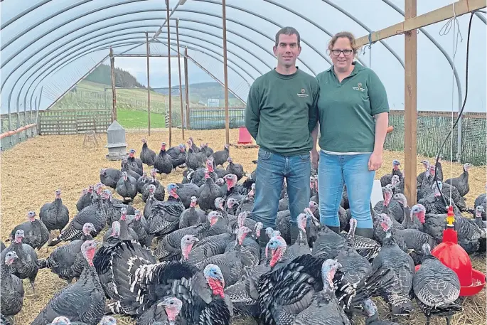  ?? ?? PRECAUTION­ARY MEASURE: Becky Perry and Ian Stuart have taken the decision to bring their turkeys indoors at Ledmacoy, near Strathdon.