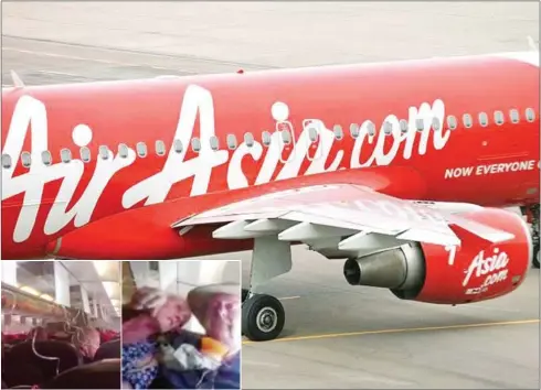  ?? STRAITS TIMES/TWITTER ?? AirAsia has apologised for the incident, saying the plane had encountere­d a ‘technical issue’ that caused it to plunge more that 20,000 feet. Images posted online showed passengers putting on oxygen masks (inset).