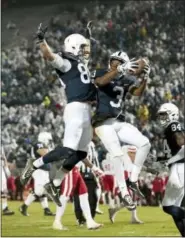  ?? CHRIS KNIGHT — THE ASSOCIATED PRESS ?? Penn State’s DeAndre Thompkins (3) celebrates with teammate Mike Gesicki (88) after catching a touchdown pass against Nebraska during the first half of an NCAA college football game in State College, Pa., Saturday.