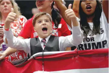  ?? — Reuters ?? A young participan­t gestures during a campaign rally with US President Donald Trump in Estero, Florida.