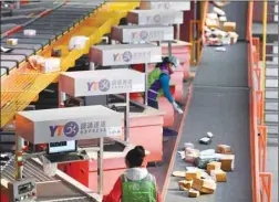  ??  ?? Women work on sorting parcels at a YTO Express logistics centre ahead of the Singles’ Day shopping festival in Changchun, Jilin province. China is gearing up for the biggest shopping event of the year tomorrow, a day dominated by e-commerce giant Alibaba Group which saw $25bn worth of goods sold on its platforms alone in the 24-hour period last year.