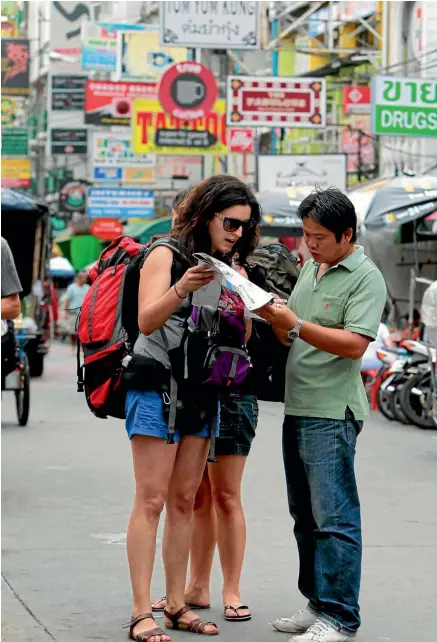  ?? Photo: REUTERS ?? Tourists ask a tuk tuk driver for directions in Bangkok, Thailand. Whether or not you’re lost, the best way to find out what to do, where to go, what to eat, or where to drink when you’re travelling is to talk to the locals.