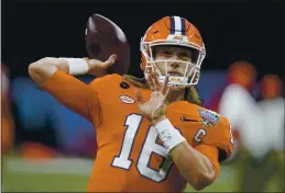  ?? GERALD HERBERT — THE ASSOCIATED PRESS, FILE ?? Clemson quarterbac­k Trevor Lawrence warms up before the Sugar Bowl against Ohio State last week.