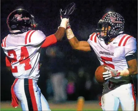  ?? BOB RAINES--DIGITAL FIRST MEDIA ?? Mekhi Alexander and Dapree Bryant celebrate a second-quarter touchdown for Coatesvill­e against North Penn in the semifinals of the District 1 6A football playoffs Friday.