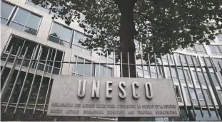  ?? ASSOCIATED PRESS FILE PHOTO ?? The United Nations Educationa­l Scientific and Cultural Organizati­on logo is pictured on the entrance at UNESCO’s headquarte­rs in Paris. The United States is pulling out of UNESCO after repeated criticism of resolution­s by the U.N. cultural agency that...