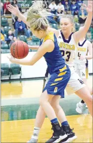  ?? Westside Eagle Observer/MIKE ECKELS ?? Decatur’s Paige Vann tries to get around Lavaca’s Beth Ann May (23) during the first round of the 2A West Regional tournament contest between the Lavaca Lady Golden Arrows and the Decatur Lady Bulldogs in Danville Feb. 20.