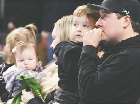  ?? JONATHAN HAYWARD/THE CANADIAN PRESS ?? Scott Jenkins, husband of late Saskatchew­an curler Aly Jenkins, reacts alongside family, including his three children Brady, Avery and Sydney during a tribute to his wife Sunday before the 4th draw at the Scotties Tournament of Hearts in Moose Jaw.