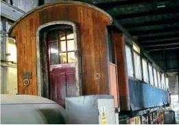  ?? ?? Its sides and windows covered by protective sheeting, GCR Barnum coach No. 228 undergoes restoratio­n under cover in the Ruddington workshops. ROBIN JONES