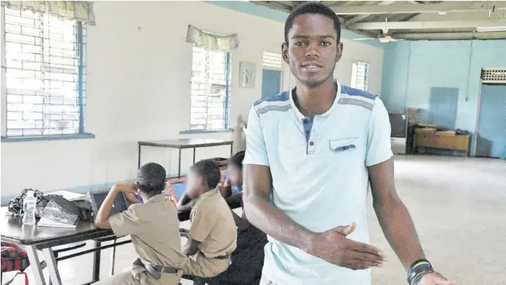  ?? (Photos: Naphtali Junior) ?? Treniel Lowe talks to the Jamaica Observer during a class at Maxfield Park Children’s Home. He said his experience growing up at the home shaped him into the person he is today.