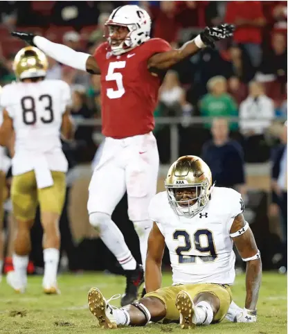  ??  ?? Stanford safety Frank Buncom ( 5) enjoys the sight of Kevin Stepherson’s glum look after he dropped a pass on fourth down. | AP