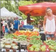  ?? AHagin/SJ ?? Teresa Lave of Cartersvil­le, Ga. brought a variety of fresh vegetables grown in her garden to Rockmart Farmers Market Thursday.