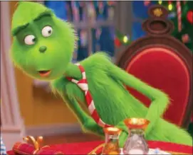  ?? UNIVERSAL PICTURES VIA AP, FILE ?? This file image released by Universal Pictures show the Grinch, voiced by Benedict Cumberbatc­h, in a scene from “The Grinch.”