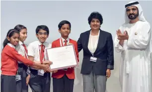  ?? — Wam photos ?? Kindergart­en Starters students along with their principal Asha Alexander were honoured by Sheikh Mohammed for their support to Dubai Cares on its tenth anniversar­y.