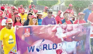  ?? Photo: Rotary Club ?? District Governor, Rotary Internatio­nal District 9125, Rtn. Sagab Sani Ahmed (middle in purple) and the President, Rotary Club of Abuja Maitama, Rtn. Agwu Joyce Ijroma, leading Rotarians to mark the 2023 World Polio Day Walk by the Nigeria National PolioPlus Committee and the Rotary Internatio­nal, in Abuja yesterday.