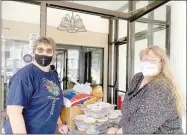  ?? COURTESY PHOTO ?? Sheila Andrews, left, a member of Prairie Grove Christian Church, delivers free barbecue lunches for staff at Prairie Grove Health and Rehab Center. LIFE Ministries and area churches recently provided meals to city employees, first responders and others who have worked this year throughout the pandemic.