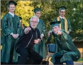  ??  ?? Principal Tim Clements and graduate Tanner Burnell pose for a photo.