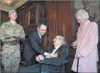  ??  ?? PRESENTATI­ON: Mr Currie, with wife Barbara and Emmanuel Coche.