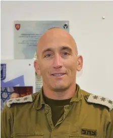  ?? (Seth J. Frantzman) ?? COMMANDER LT.-COL. GIL HIRSCHON (L), an IDF reservist officer called up in early October, has helped lead efforts to bring security to northern Israel.