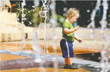  ?? STAFF PHOTO BY ERIN O. SMITH ?? Alexander Langdon, 1, plays in the fountain at Coolidge Park on Monday. Alexander and his mom, who are from Indiana, were visiting Alexander’s grandparen­ts in Adairsvill­e, Georgia, and decided to make a day trip to Chattanoog­a for hiking and cooling off in the park.