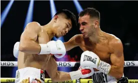  ?? Stier/Getty Images ?? Australia’s Andrew Moloney goes toe-to-toe with Junto Nakatani of Japan in the junior bantamweig­ht bout in Las Vegas won by Nakatani wth a KO in the 12th. Photograph: Sarah