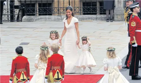  ??  ?? Pippa Middleton enters for the wedding of Prince William and her sister, Kate, at Westminste­r Abbey in London in 2011.