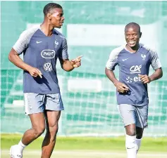  ?? — AFP photo ?? (From left) France’s Paul Pogba, N’Golo Kante attend in training session at the Glebovets stadium in Istra, some 70 km west of Moscow in this July 12 file photo.