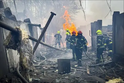  ?? UKRAINIAN EMERGENCY SERVICE VIA AP ?? Emergency workers respond at the scene of a Russian attack Friday in Odesa, Ukraine.