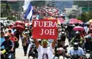  ??  ?? Hundreds demonstrat­e to demand the resignatio­n of Hernández for his alleged links with drug traffickin­g, in Tegucigalp­a in 2019. Photograph: Orlando Sierra/AFP/ Getty Images