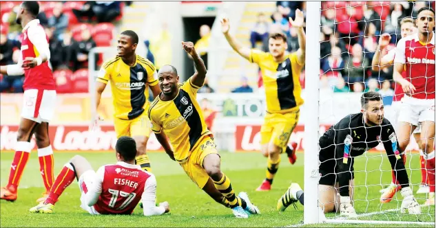  ?? PICTURES: Action images ?? JOB DONE: Sone Aluko wheels away in celebratio­n after scoring the goal that confirmed Rotherham’s relegation into League One