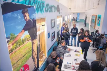  ?? EDDIE MOORE/JOURNAL ?? Relatives and friends of Isiah Lovato, 16, held a bone marrow registrati­on drive Tuesday at Capital High School. Isiah is fighting leukemia and needs the donation of matching bone marrow for a transplant.