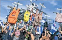  ?? AP PHOTO ?? University students take part in a march against Nicaragua’s President Daniel Ortega in Managua, Nicaragua, Wednesday.