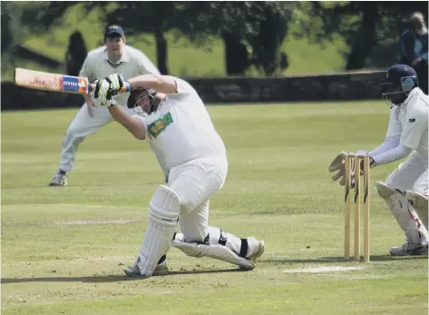  ??  ?? MIGHTY HEAVE: Chris Ramsden goes for a big hit during the Halifax League’s victory over their Huddersfie­ld Central counterpar­ts