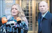  ?? Mary Altaffer Associated Press ?? MICHAEL AVENATTI, with Stormy Daniels in April, says the firm Eagan Avenatti doesn’t represent her and has no right to her crowdfunde­d donations.