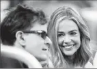 ?? By Elsa, Getty Images ?? Still friends: Sheen and ex Denise Richards catch Saturday’s Yankees-Mets game. Today, “the communicat­ion is 100 times what it was married,” Sheen says.