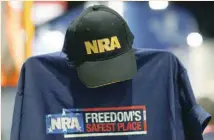  ?? — Reuters ?? A cap and shirt are displayed at the booth for the National Rifle Associatio­n (NRA) at the Conservati­ve Political Action Conference (CPAC) at National Harbor, Maryland, US.
