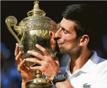  ?? Andrew Parsons/TNS ?? Novak Djokovic, who entered the tournament ranked No. 21, became the lowest seed to win at the All England Club since Goran Ivanisevic, who was ranked 125th at the time, claimed the title in 2001. With the win, Djokovic improved his record to 4-1 in Wimbledon finals.