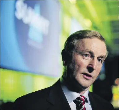  ?? Aidan Crawle y / Blombe rg News files ?? Enda Kenny, Ireland’s prime minister, says his country will leave the eurozone’s bailout program without a credit line in place as a precaution against further monetary trouble.