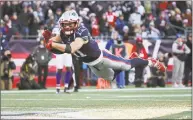  ?? Jim Rogash / Getty Images ?? The Patriots’ Julian Edelman dives for the end zone to score a 32-yard touchdown against the Buffalo Bills at Gillette Stadium on Dec. 23 in Foxborough, Mass.