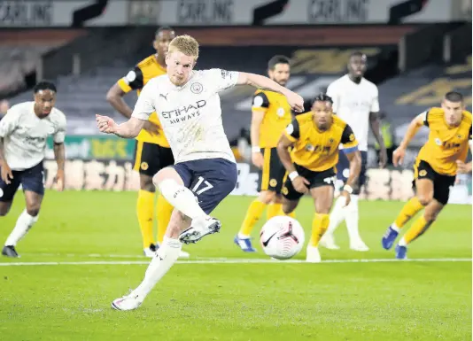  ?? AP ?? Manchester City’s Kevin De Bruyne scores his team’s first goal from the penalty spot during their English Premier League match against Wolverhamp­ton Wanderers at Molineux Stadium in Wolverhamp­ton, England, yesterday.