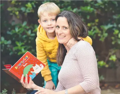  ??  ?? Mum Brooke knows reading to Elliot, 5, helps his literacy skills. Picture: Nicki Connolly